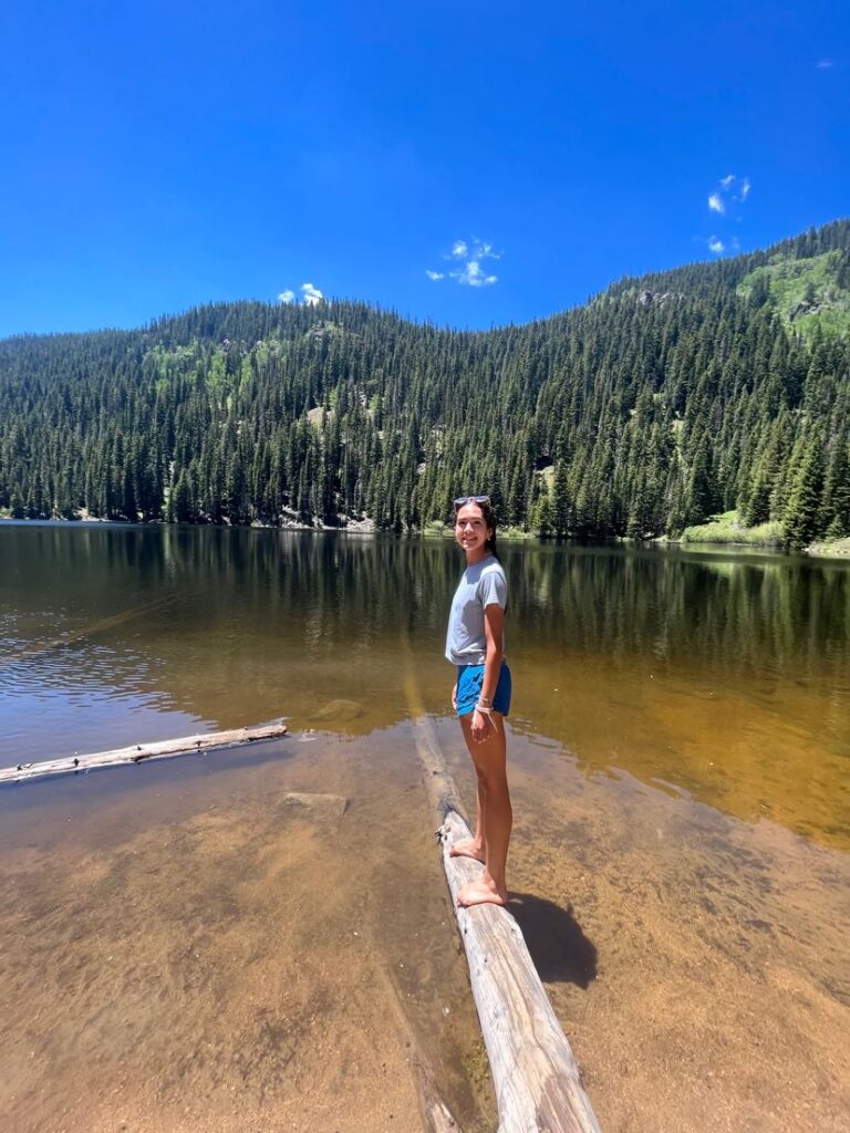 Photo of senior Anika Bagal on a lake
