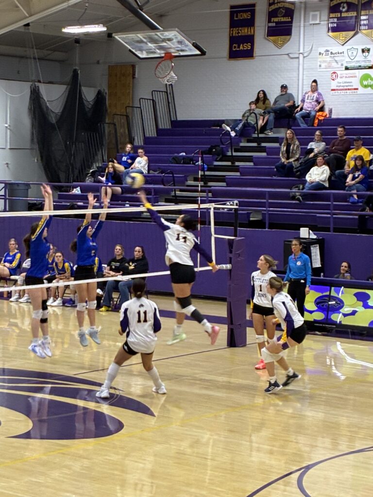 Player #14 Sophia fights at the net