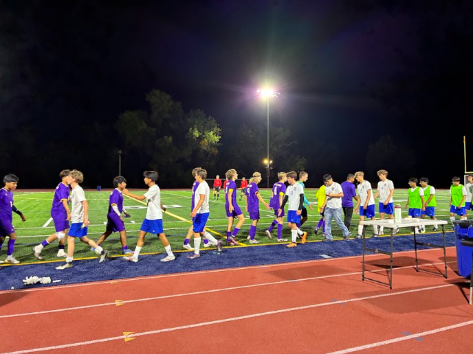 The Littleton varsity team shaking hands with Englewood 