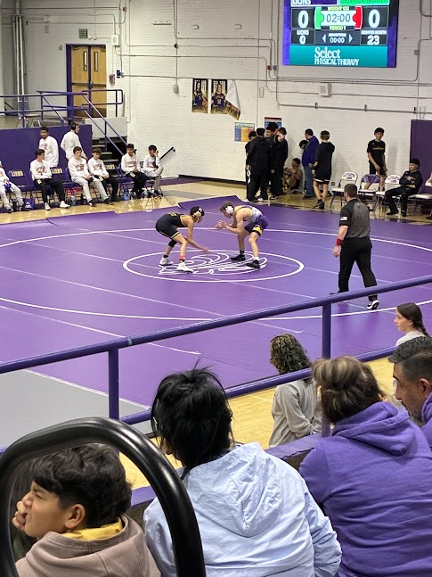 May wrestling against North High