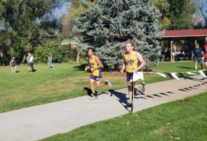 Two runners jog beside each other