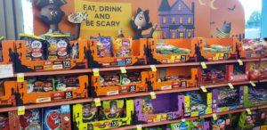 A shelf of candy is displayed in a King Soopers