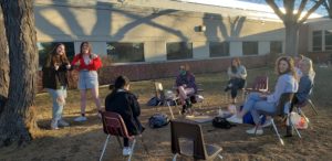 The JSC club gathers outside to celebrate Hanukkah