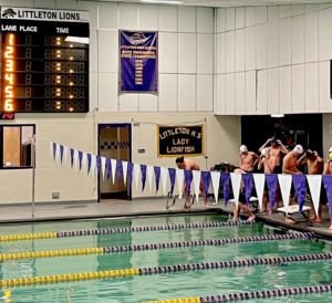Boys prepare in front of the pool