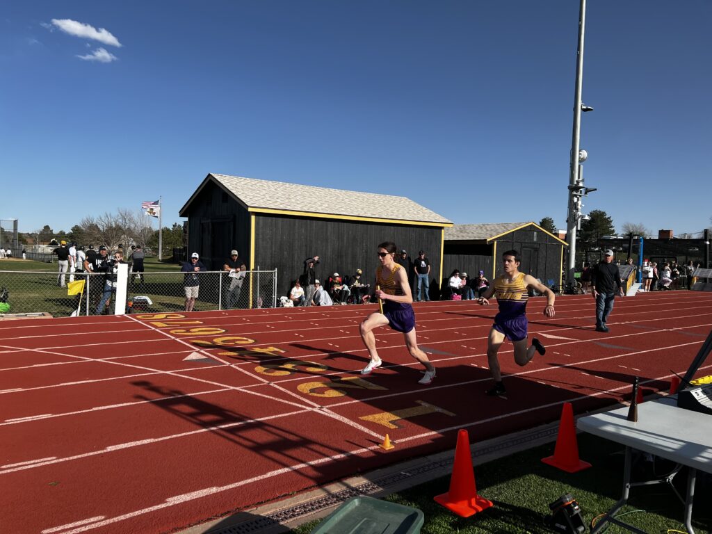 Runners perform a handoff