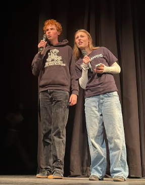 Emmett and Kaylie performing a skit before one of the performances