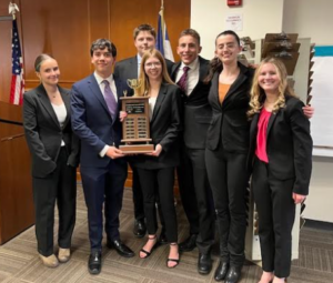 Team A poses with their well-earned trophy.