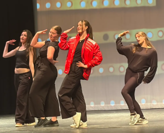 Kadence McMillan leads the Syrens in 90s style choreography.