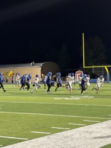 football players chasing a ball