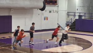 Players running to grab a ball.